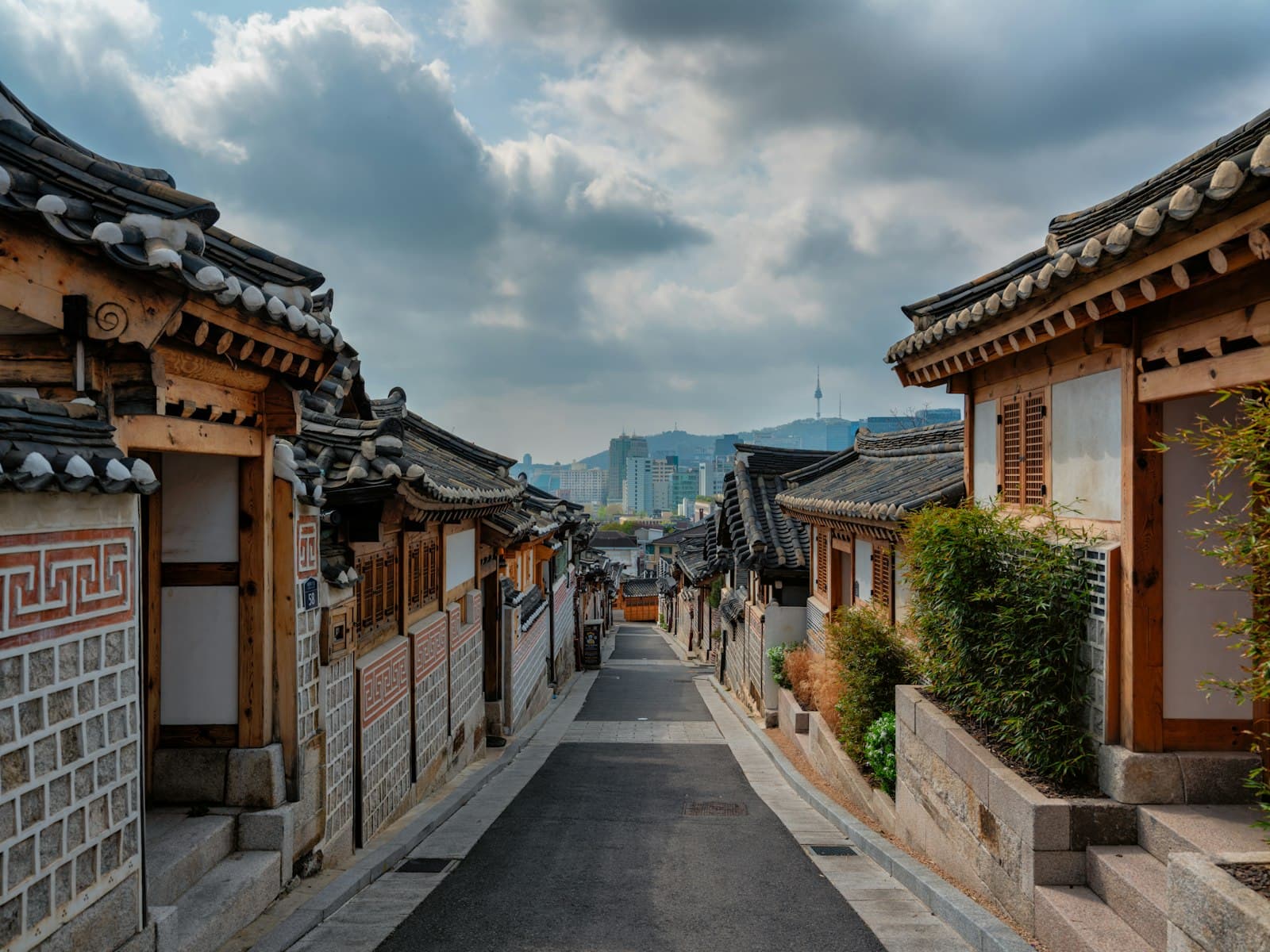 A street of traditional Korean houses in Seoul with N Seoul Tower beyond
